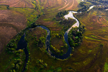 River's Curving Path: Scenic Overhead View of the Meandering Waters - 773935263
