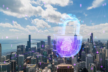 Chicago city skyline with a hologram of a digital padlock and fingerprint over it, blue and purple...