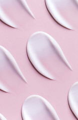 pattern cosmetic smears of creamy texture on pink background