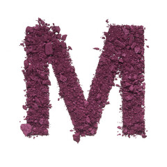 Stencil capital letter M made by burgundy crushed eye shadow or broken powder isolated on white background.