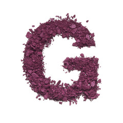 Stencil capital letter G made by burgundy crushed eye shadow or broken powder isolated on white background.