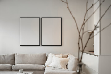Mockup of two poster frames (Din A) in the kitchen room interior. Minimalistic apartment design: Light gray interior with a poster frame. Laconic apartment design: light room with beige accents