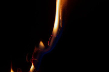 burning paper, glowing edge of paper on a black background