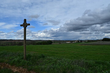 Stone cross, via crucis, with landscape