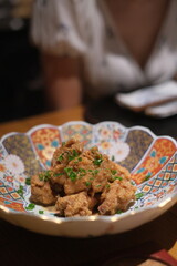 Group of japanese friend teriyaki flavoured karaage meal sharing dinning Famaus food of matsumoto japanese style deep fired chicken in japan tokyo