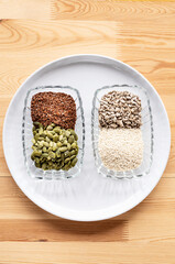 Seed cycling for hormone balance, to balance pre and post menopausal hormones. Flax, pumpkin, sesame and sunflower seeds. Balancing hormones - estrogen and progesterone. Woman health, fertility