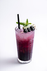 Cocktail with blueberries and mint on a white background.