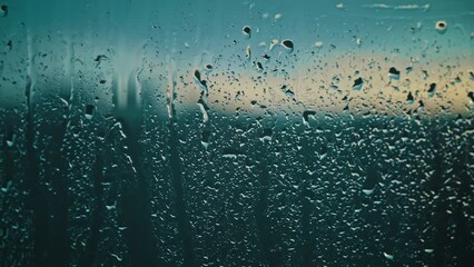 Droplets speckle the glass in the cool, serene twilight, reflecting the subtle interplay of light and water - Powered by Adobe