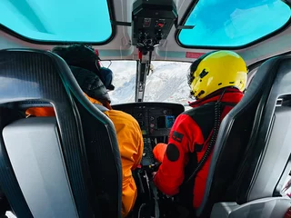 Fotobehang Inside the helicopter flight for heliboarding in the Caucasus Mountains. Helicopter in the mountains. freeride heliboarding in the Caucasus. © Chawran