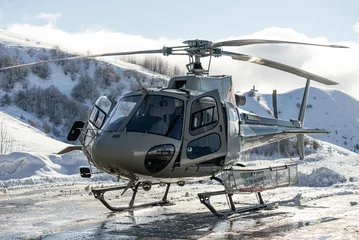 Fotobehang Helicopter is standing on a landing field in the mountains. Helicopter in the mountains. freeride heliboarding in the Caucasus. © Chawran