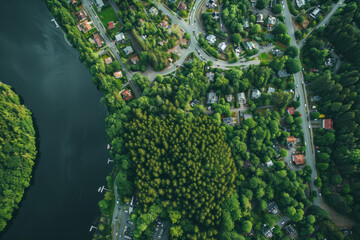 Overhead view of a town situated near a winding river, with buildings and bridges visible