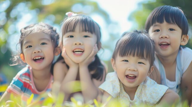 Group image of cute asian children playing in the park
