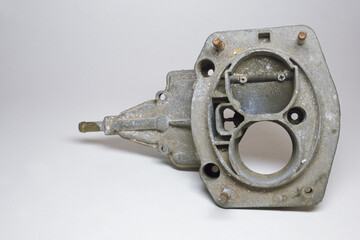 dismantled dual chamber carburetors air intake assembly. upper part with throttle valve in first...