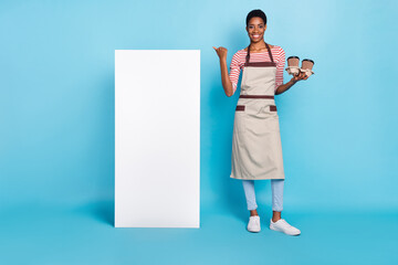 Full size photo of young man woman indicate thumb board select recommend service isolated over blue...