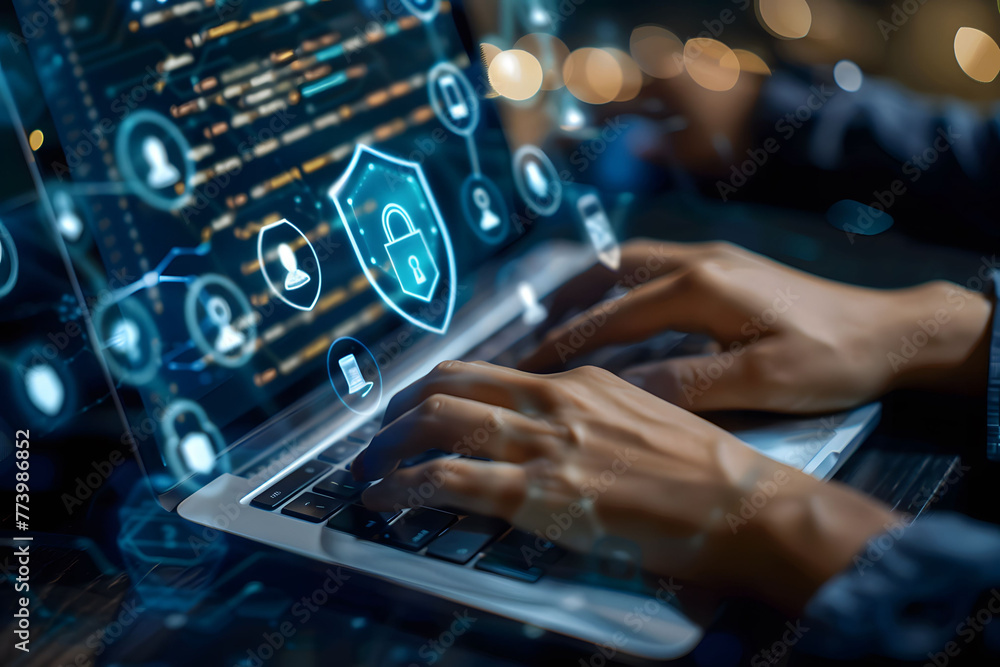 Poster a person's hands are typing on their laptop with an abstract digital shield and keyhole icon hoverin