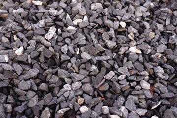Crushed grey stone on the ground texture natural background