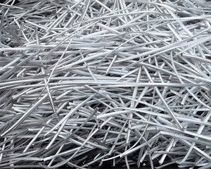 Landscape view of a large heap of pure aluminium wire recycled from power cables