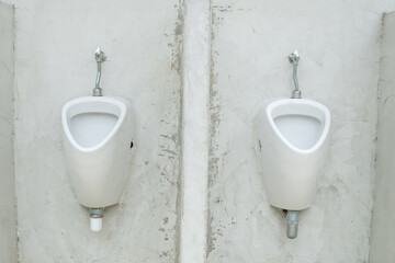 Row of outdoor urinals men public toilet. - 773997604