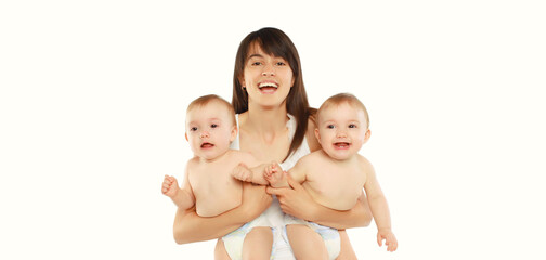 Happy cheerful smiling young mother holding baby on white background