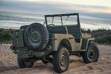 war jeep standing on the beach