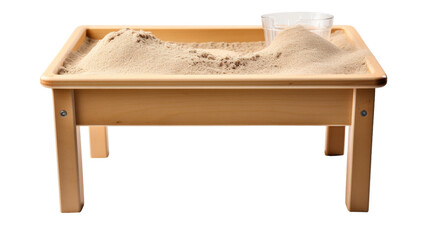 A wooden table holds a sand tray, creating an enchanting scene