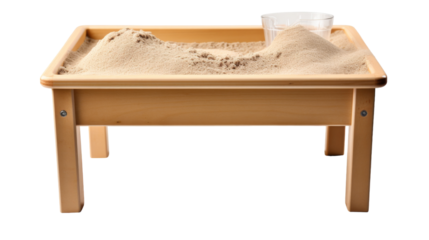 A wooden table holds a sand tray, creating an enchanting scene