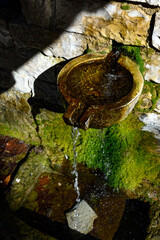 Traditional stone drinking fountain in Epirus, Greece - 774014415