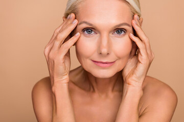 Photo portrait of gorgeous attractive senior older woman touch face smooth soft shoulders off...