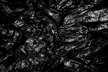 Crumpled black plastic bag Texture Background.