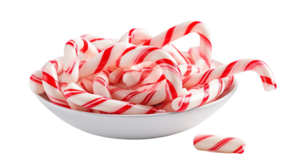 A bowl brimming with vibrant candy canes sits elegantly on a pristine white table