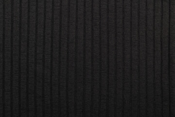 Black stretch fabric with stripes. Texture of black stretch fabric.