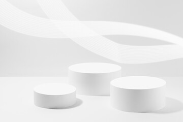 Abstract white scene mockup - three round white cylinder podiums, with glowing light lines. Template for presentation cosmetic products, goods, advertising, design, display, showing in spring style.