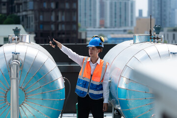 Engineers inspect the completed air conditioning and water systems to continue verifying their...