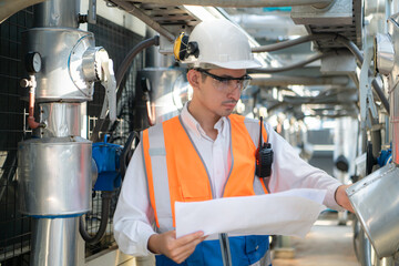 Engineers inspect the completed air conditioning and water systems to continue verifying their...