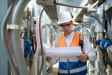 Engineers inspect the completed air conditioning and water systems to continue verifying their...