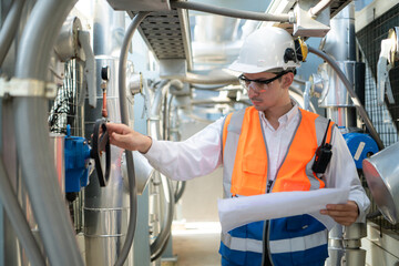 Engineers inspect the completed air conditioning and water systems to continue verifying their...