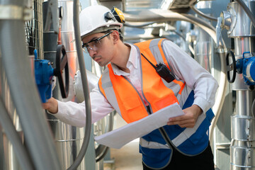 Engineers inspect the completed air conditioning and water systems to continue verifying their...