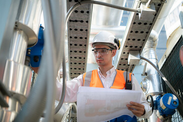 Engineers inspect the completed air conditioning and water systems to continue verifying their...
