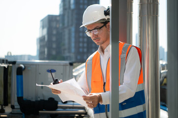 Engineers inspect the completed air conditioning and water systems to continue verifying their...