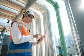 Engineers inspect the completed air conditioning and water systems to continue verifying their...