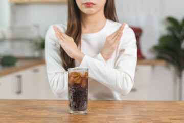 Diet, Dieting concept. Asian young woman, girl hand gesture no, deny or refuse cola drink, sweet...
