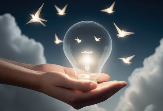An open palm cradling a clear light bulb where small birds appear to be flying out, set against a twilight sky, symbolizing the release of ideas AI generation