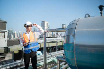 Engineers inspect the completed air conditioning and water systems to continue verifying their...
