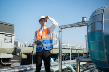 Engineers inspect the completed air conditioning and water systems to continue verifying their...