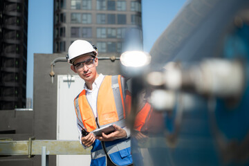 Engineers inspect the completed air conditioning and water systems to continue verifying their...