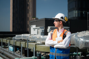 Portrait of Engineers inspect the completed air conditioning and water systems to continue...