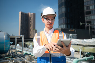 Engineers inspect the completed air conditioning and water systems to continue verifying their...