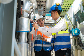 Engineers and technicians Inspect the completed air conditioning and water systems to continue...