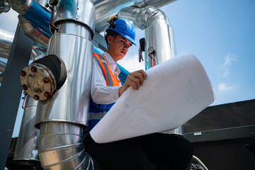 Engineers inspect the completed air conditioning and water systems to continue verifying their...