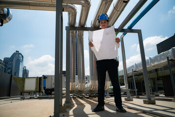 Engineers inspect the completed air conditioning and water systems to continue verifying their...